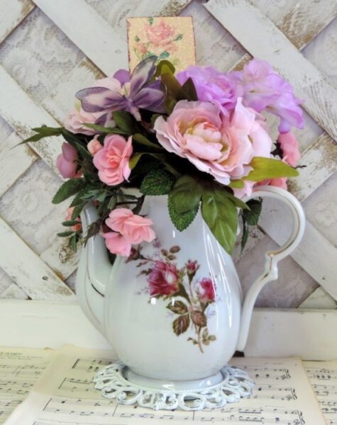 floral arrangement in a vintage teapot