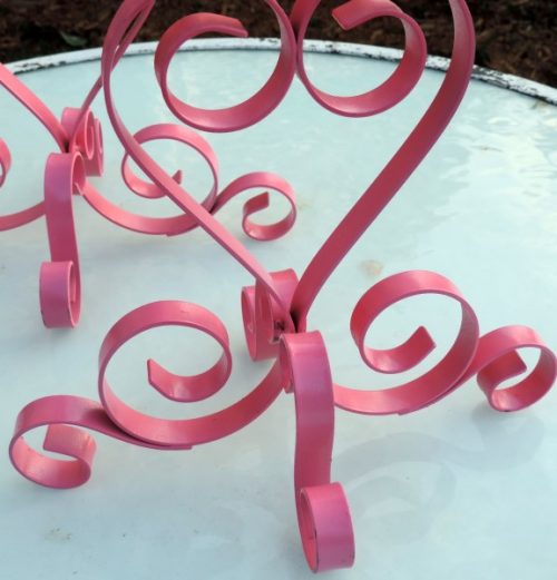 hot-pink-metal-scroll-candle-holders
