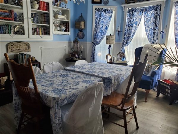 home library set up as a dining room for the holidays