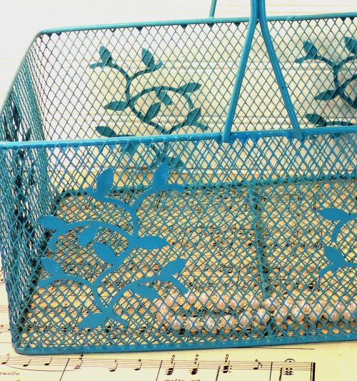 Turquoise Painted Metal Basket closeup of vine motif