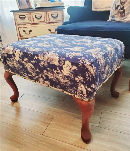 upcycled facebook marketplace ottoman recovered in blue toile fabric