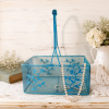 turquoise metal cottagecore basket with leaf motif