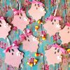 Pink glitter wooden ghost Halloween ornaments with polka dot bows and white flowers, sold as a set of eight.