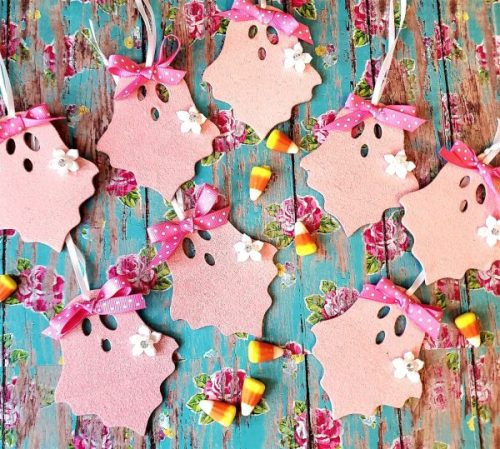Pink glitter wooden ghost Halloween ornaments with polka dot bows and white flowers, sold as a set of eight.