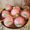 Set of seven hand-painted pink rose glitter glass Christmas ornaments styled for shabby chic and coquette holiday decor.