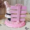 One-of-a-kind pink Santa Christmas diorama with retro reindeer, wooden North Pole sign and faux snow on a pink base back