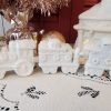 White glittered ceramic Christmas village train station with electric light and three-piece train set