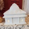White glittered ceramic Christmas village train station with electric light and three-piece train set back