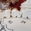White glittered ceramic Christmas village train station with electric light and three-piece train set